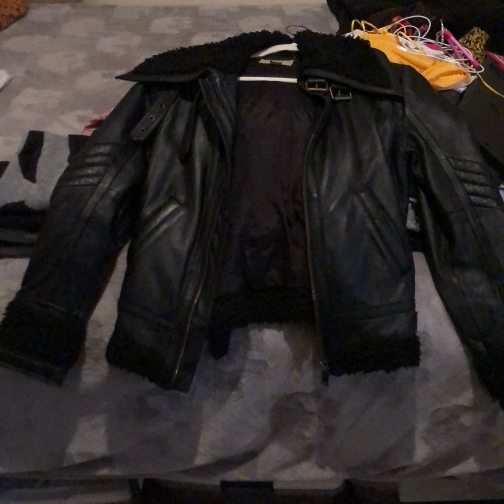 Leather jacket with fur around trim